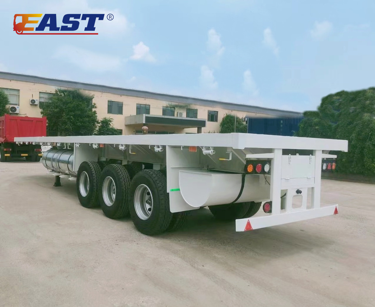FLATBED TRAILER WITH CUSTOM OVERSIZED FUEL TANK